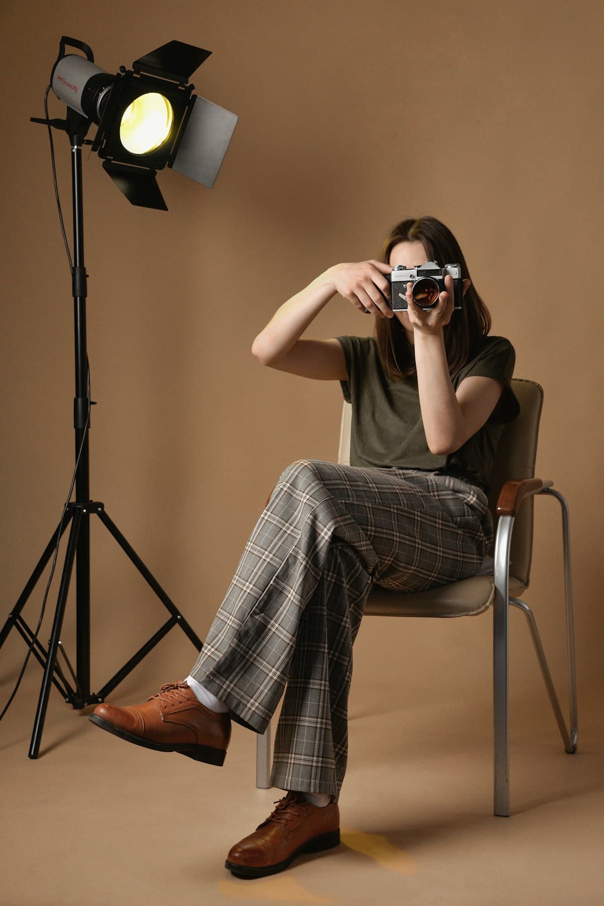 Photographer with a portable studio light